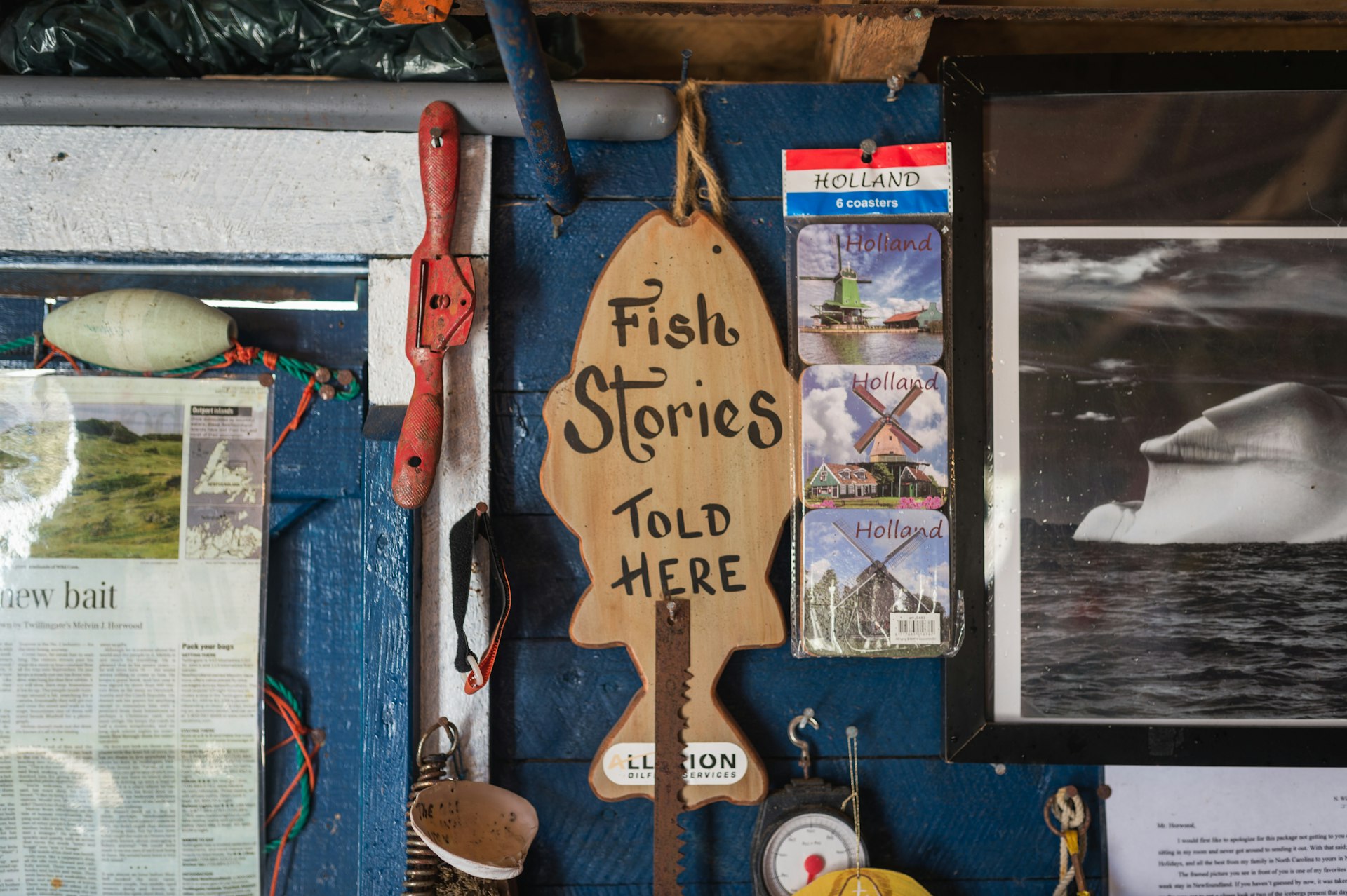 a wooden sign that says fish stories told here